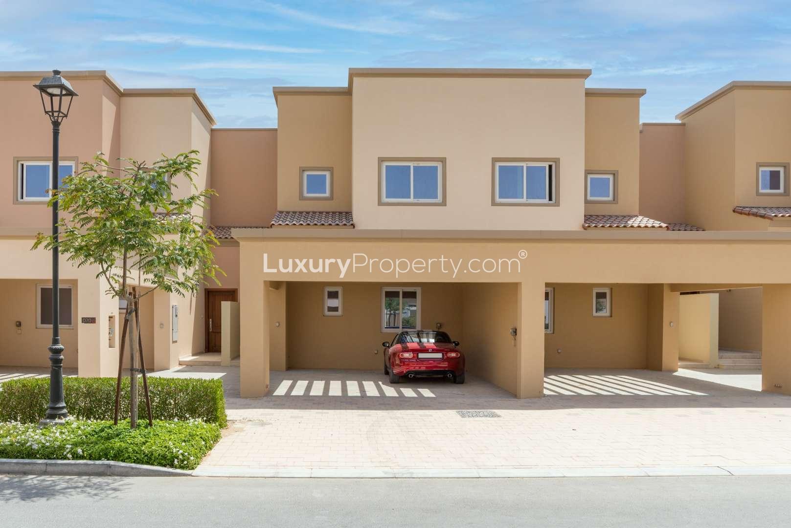 Spacious 2-bedroom townhouse exterior in Amaranta 1, Villanova, Dubai with carport