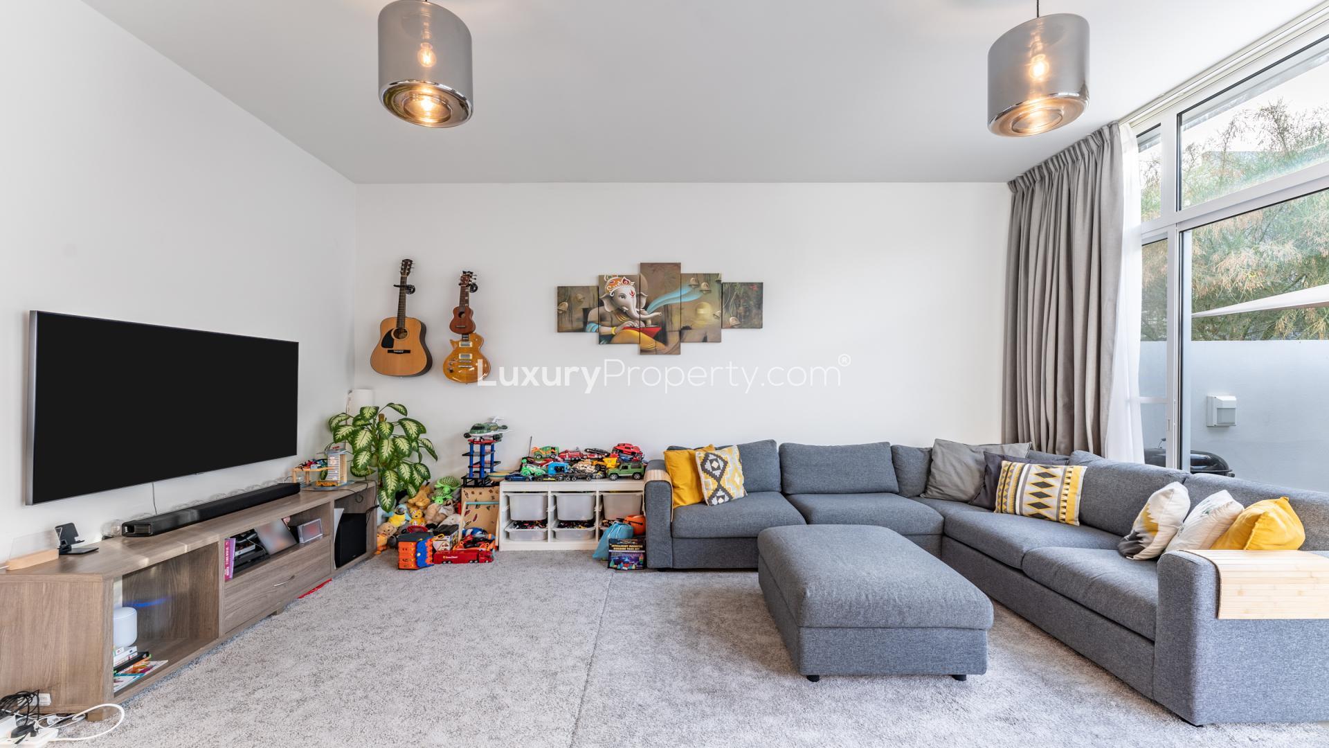 Modern living room and kitchen in Mudon Arabella townhouse for sale, open layout design