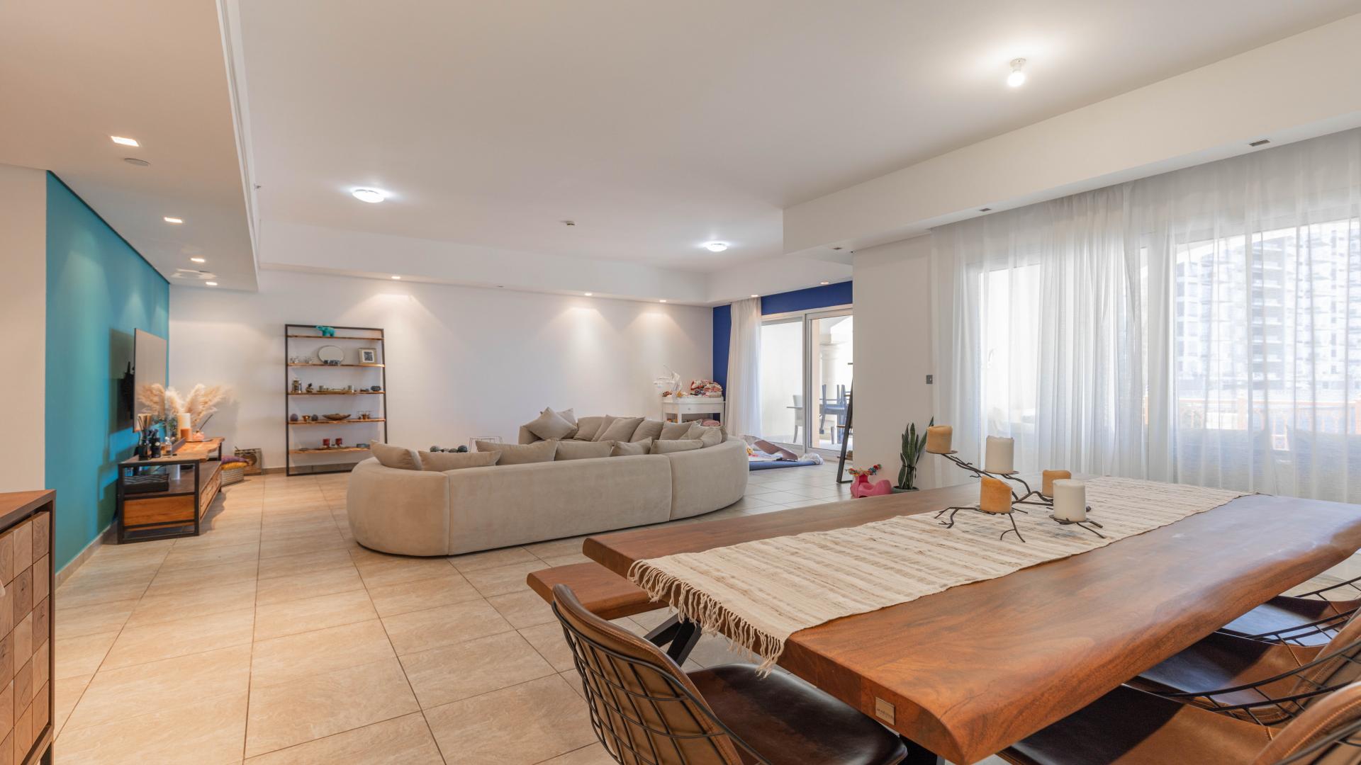 Modern living room in Palm Jumeirah townhouse, featuring elegant decor and abundant natural light