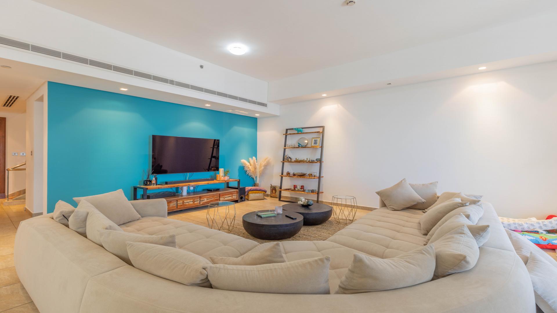 Modern living room in Palm Jumeirah townhouse with plush sofa and stylish decor
