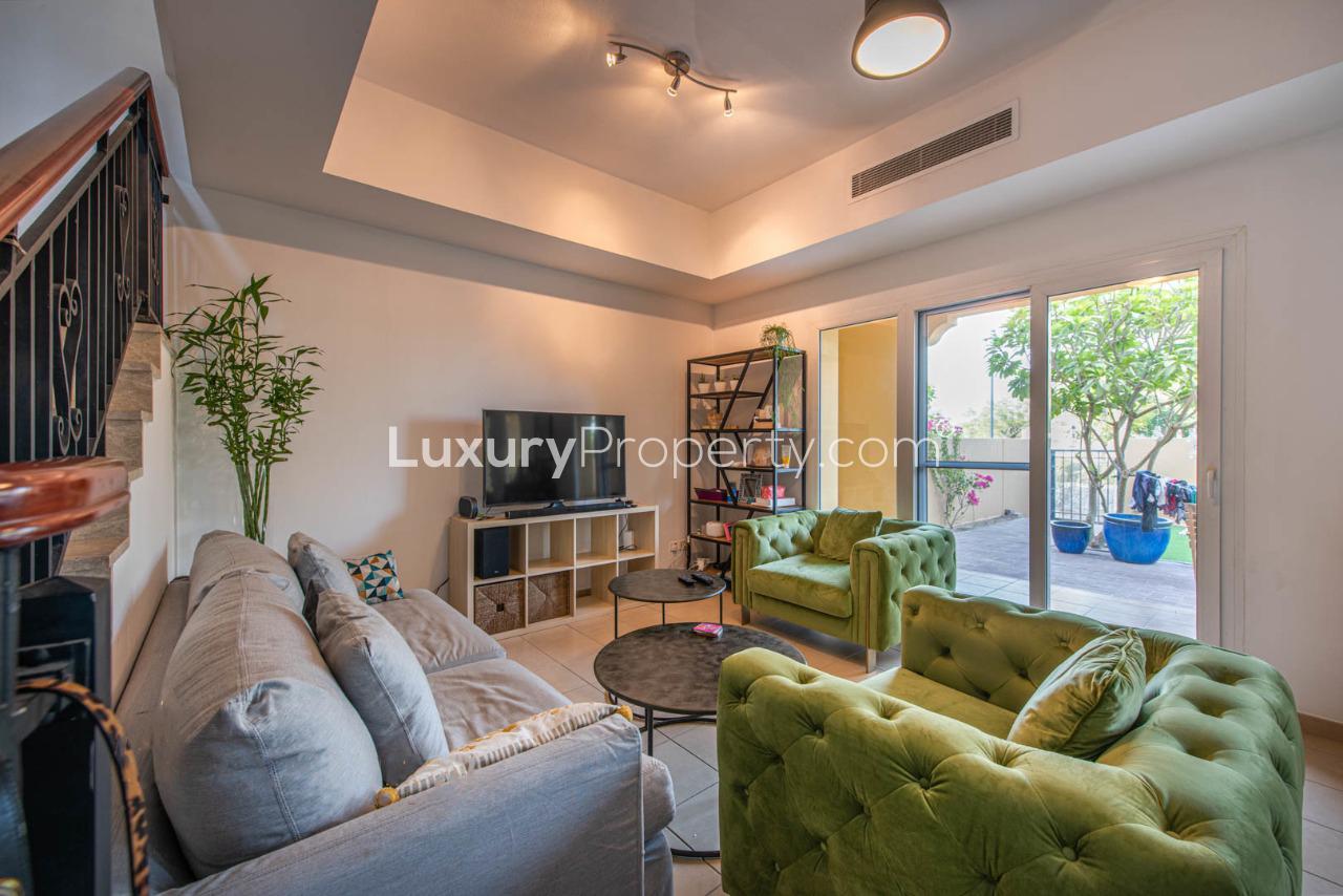 Townhouse view with serene lake in Palmera, Arabian Ranches community, Dubai