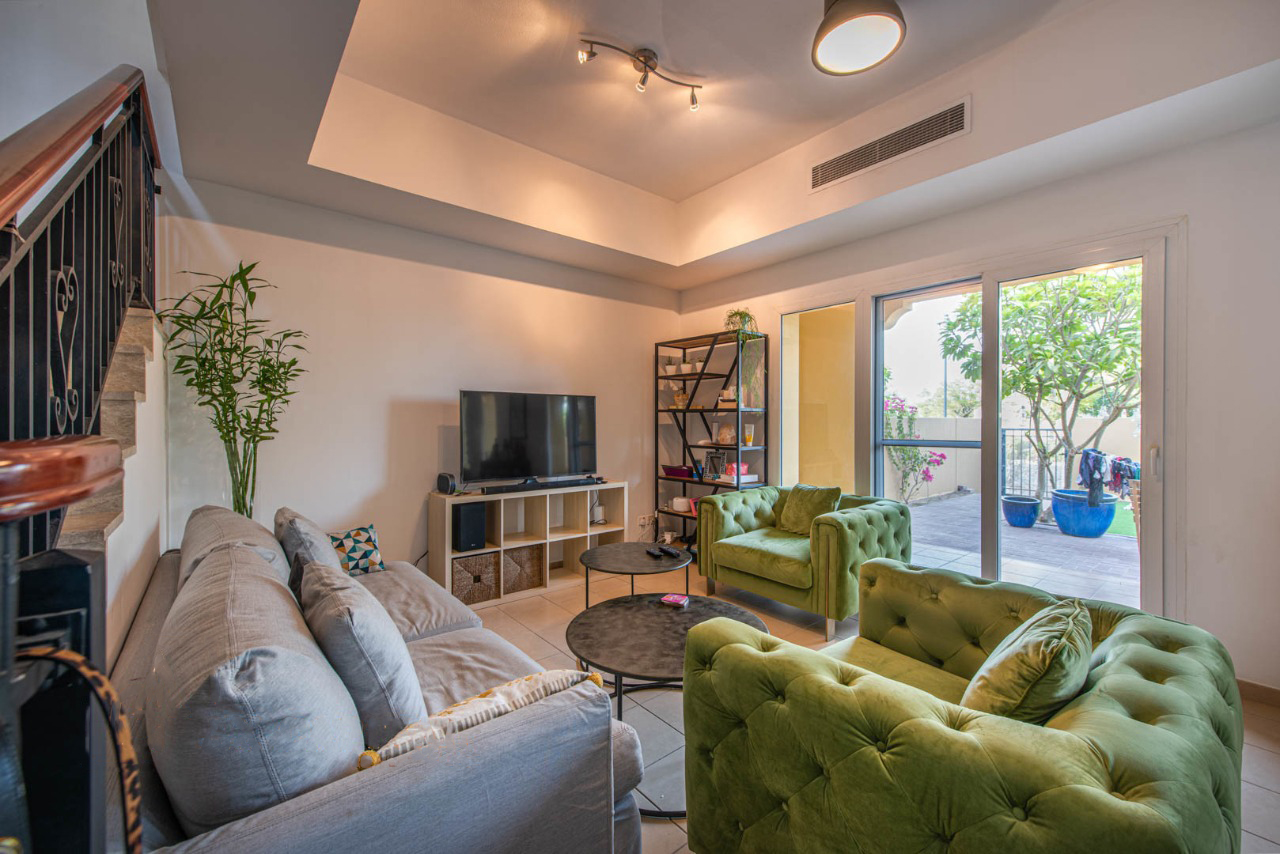 Townhouse view with serene lake in Palmera, Arabian Ranches community, Dubai