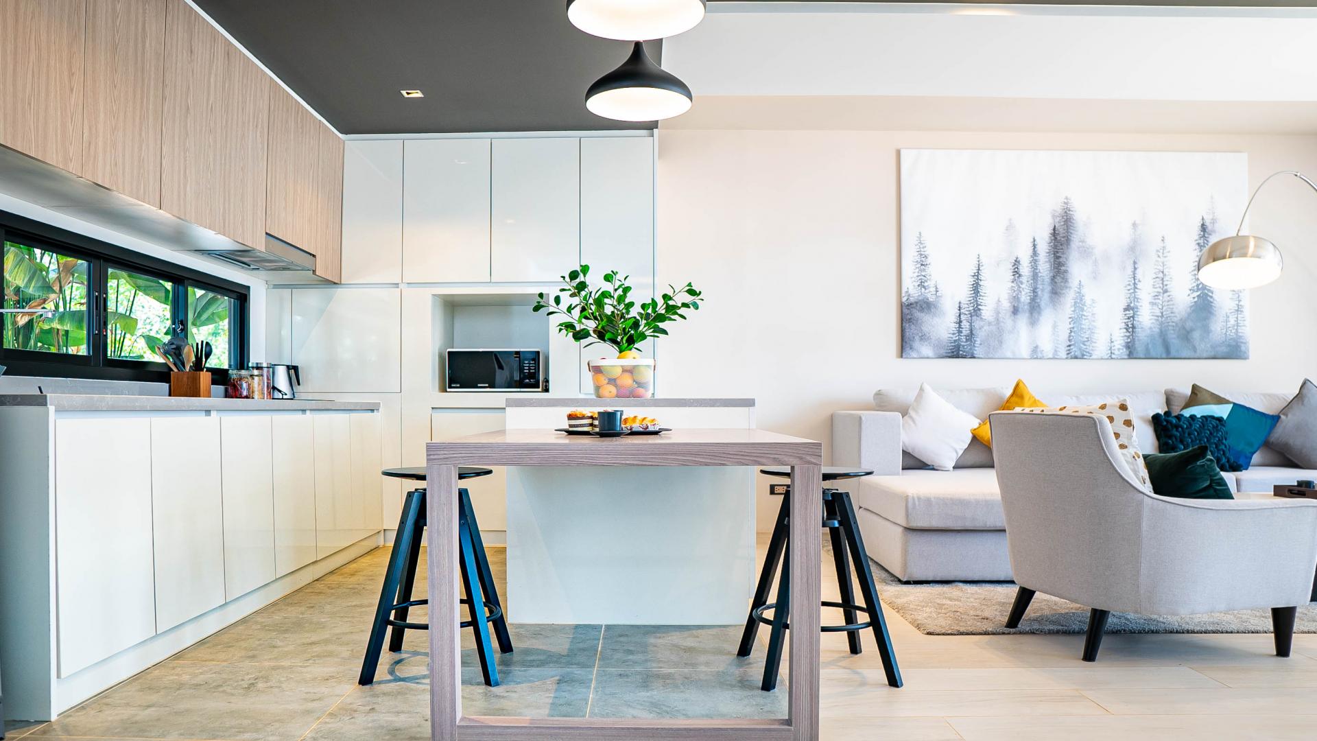 Gorgeous beachfront townhome living area in Thalang, Phuket, with modern decor and natural light