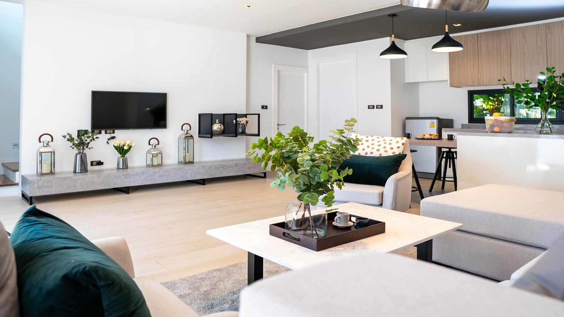 Modern living room in beachfront townhouse, Phuket, featuring elegant decor and natural light