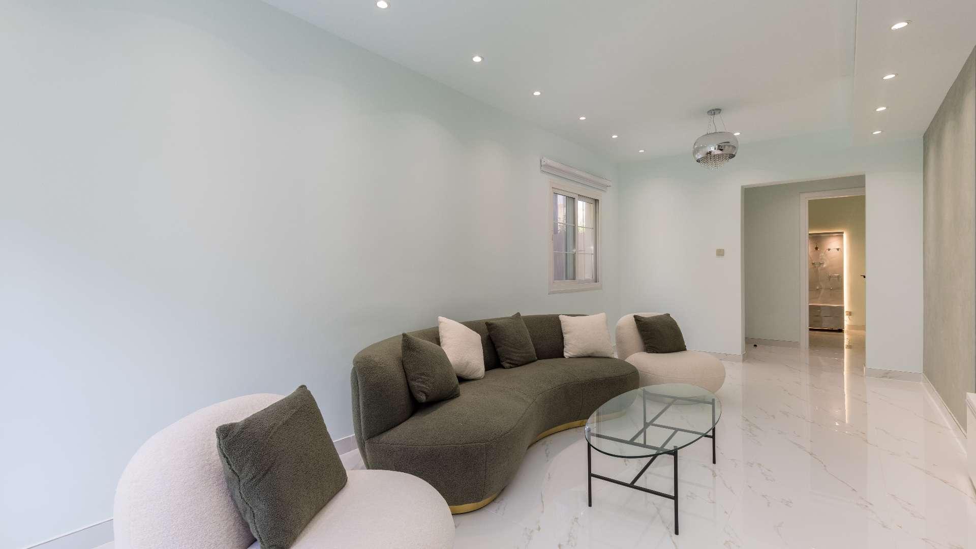Elegant living room in 2-bedroom townhouse, The Springs, Emirates Living, with garden view