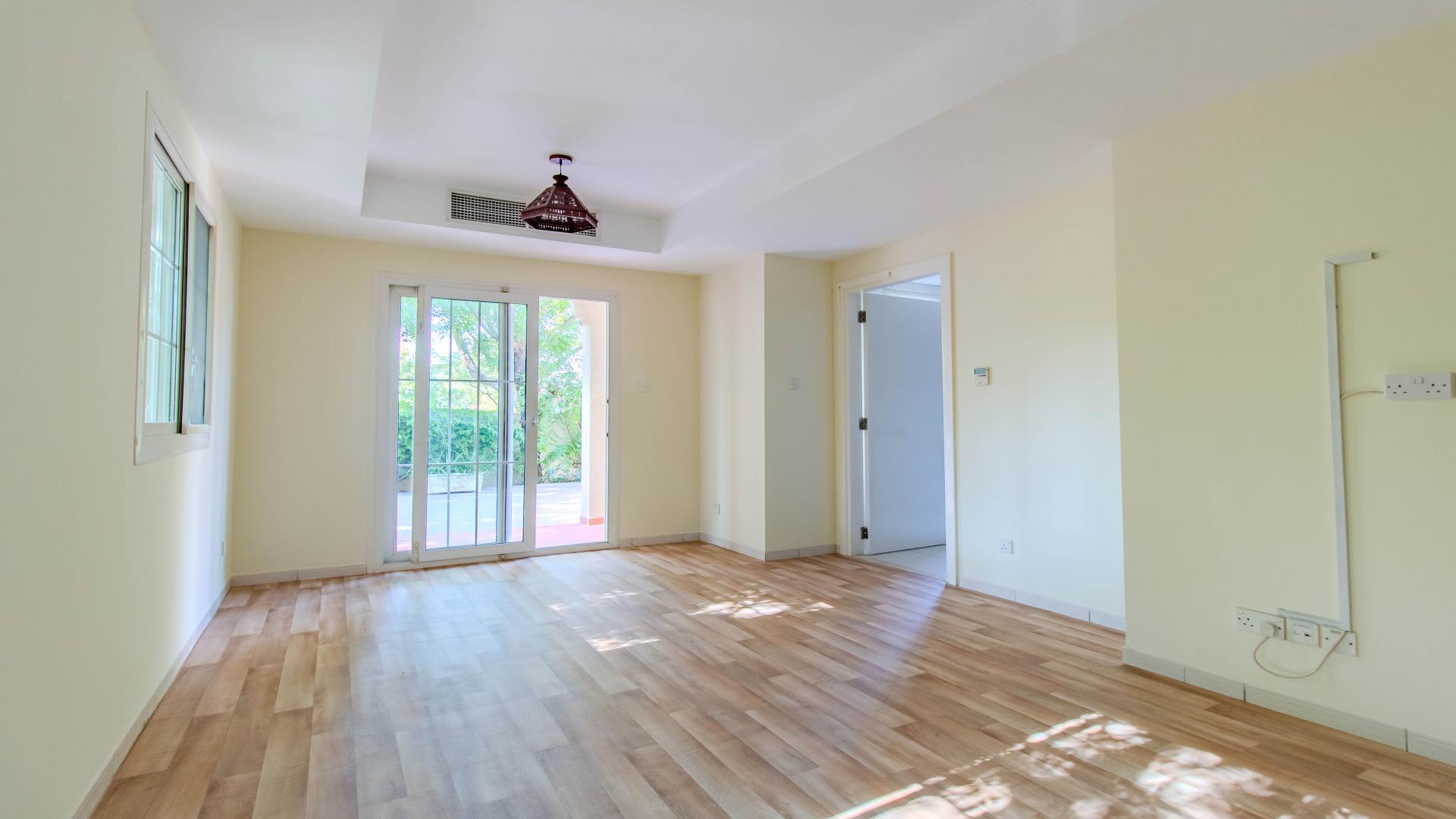 Beautiful villa exterior with garden and seating area in Springs 12, available for rent