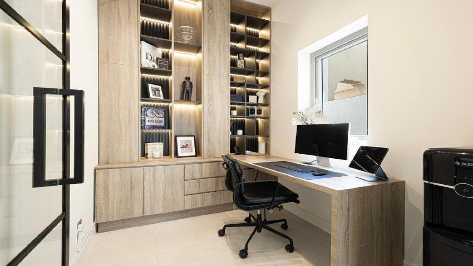 "Modern home office with built-in shelves in Springs 12 villa for rent, LP40161.","Modern home office in fully upgraded villa, The Springs 12, for rent, two bedrooms.",Outdoor dining area in upgraded villa at Springs 12, perfect for entertaining. Rent now