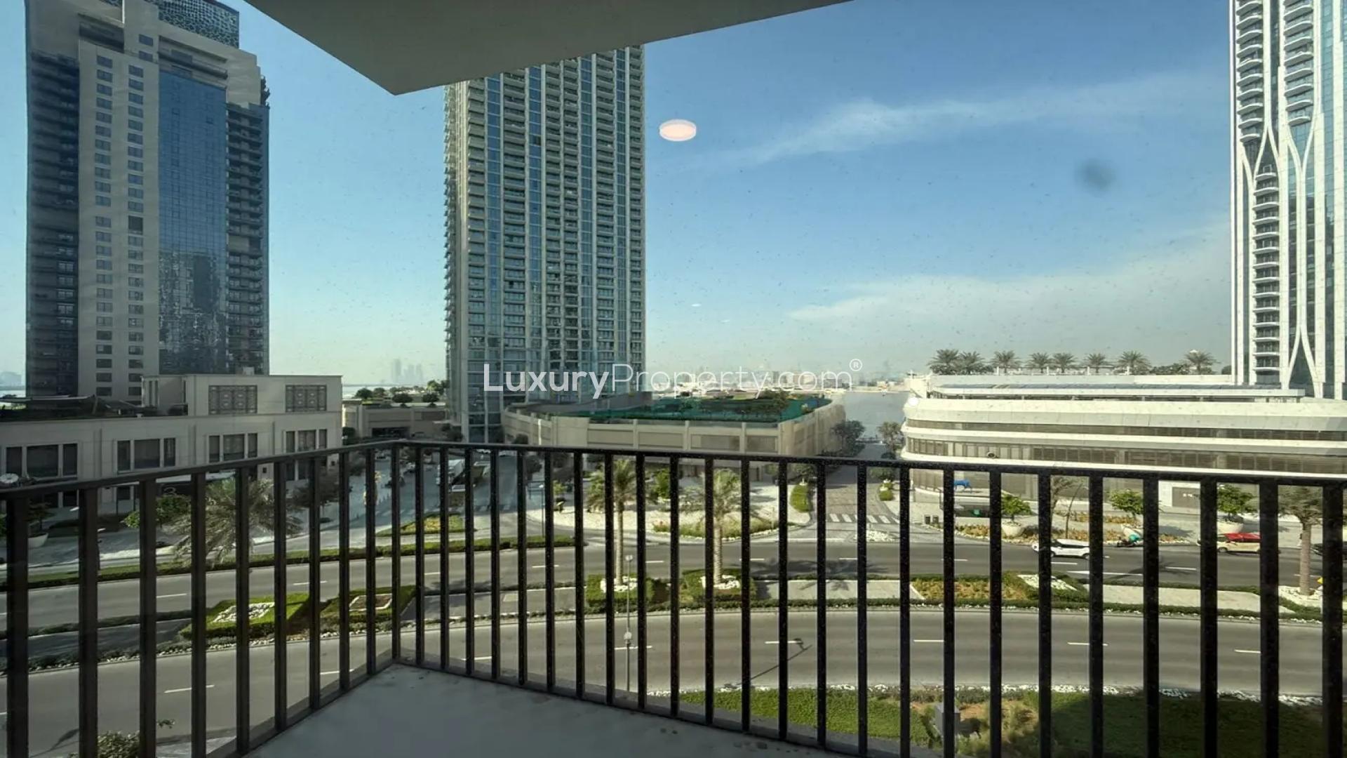 "Spacious living room in vacant 2-bedroom villa, Emaar Parkside Hills, Madinat Al Mataar.",Balcony view of Emaar Parkside Hills villa in Madinat Al Mataar community, Dubai skyline visible