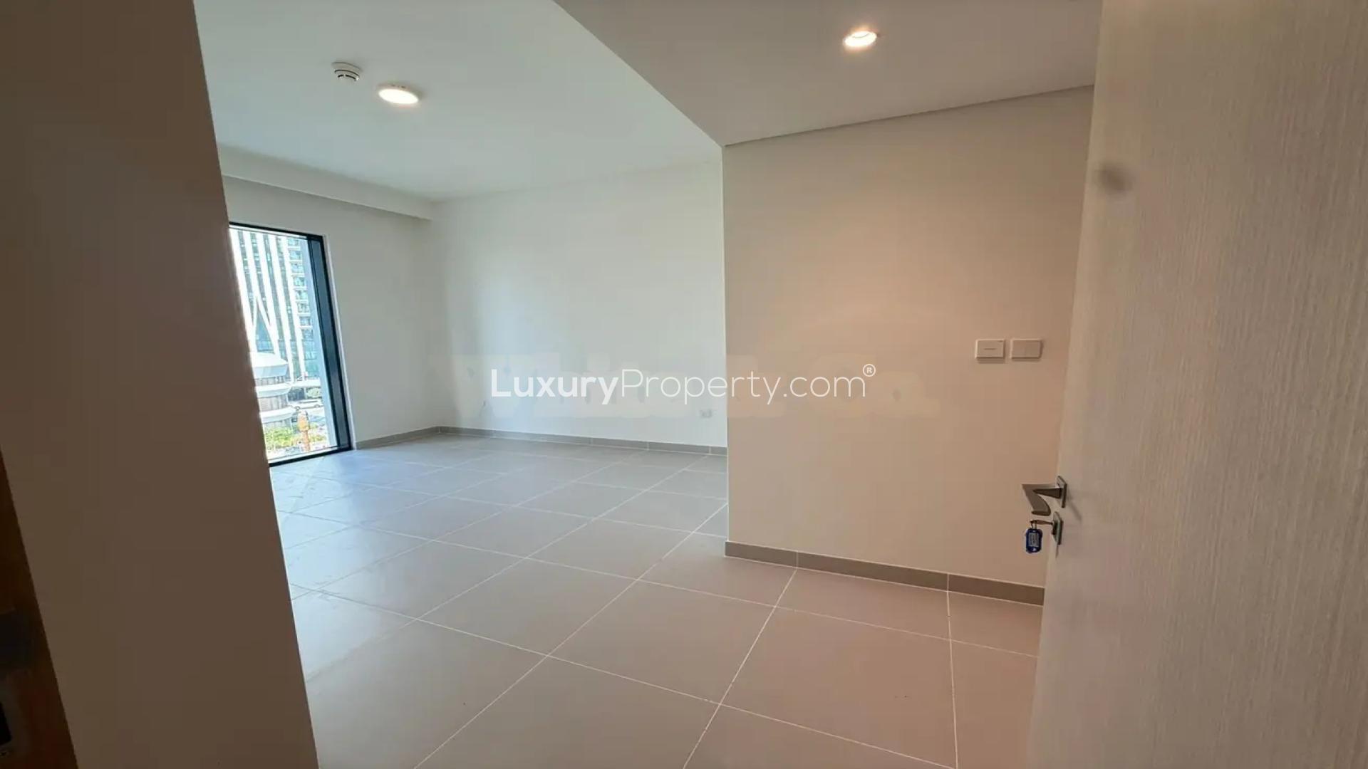 Open-plan living area in vacant Emaar Parkside Hills villa, Madinat Al Mataar, available for rent