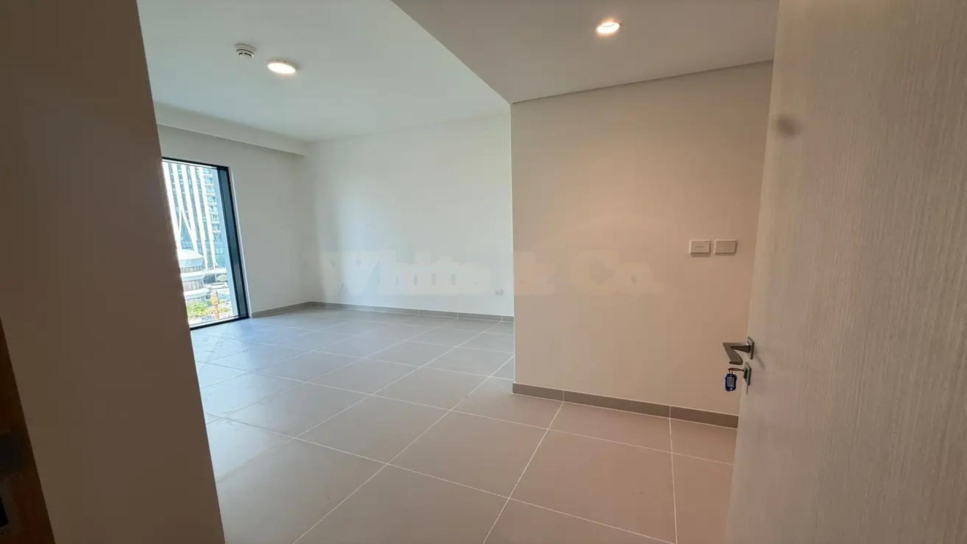 Open-plan living area in vacant Emaar Parkside Hills villa, Madinat Al Mataar, available for rent