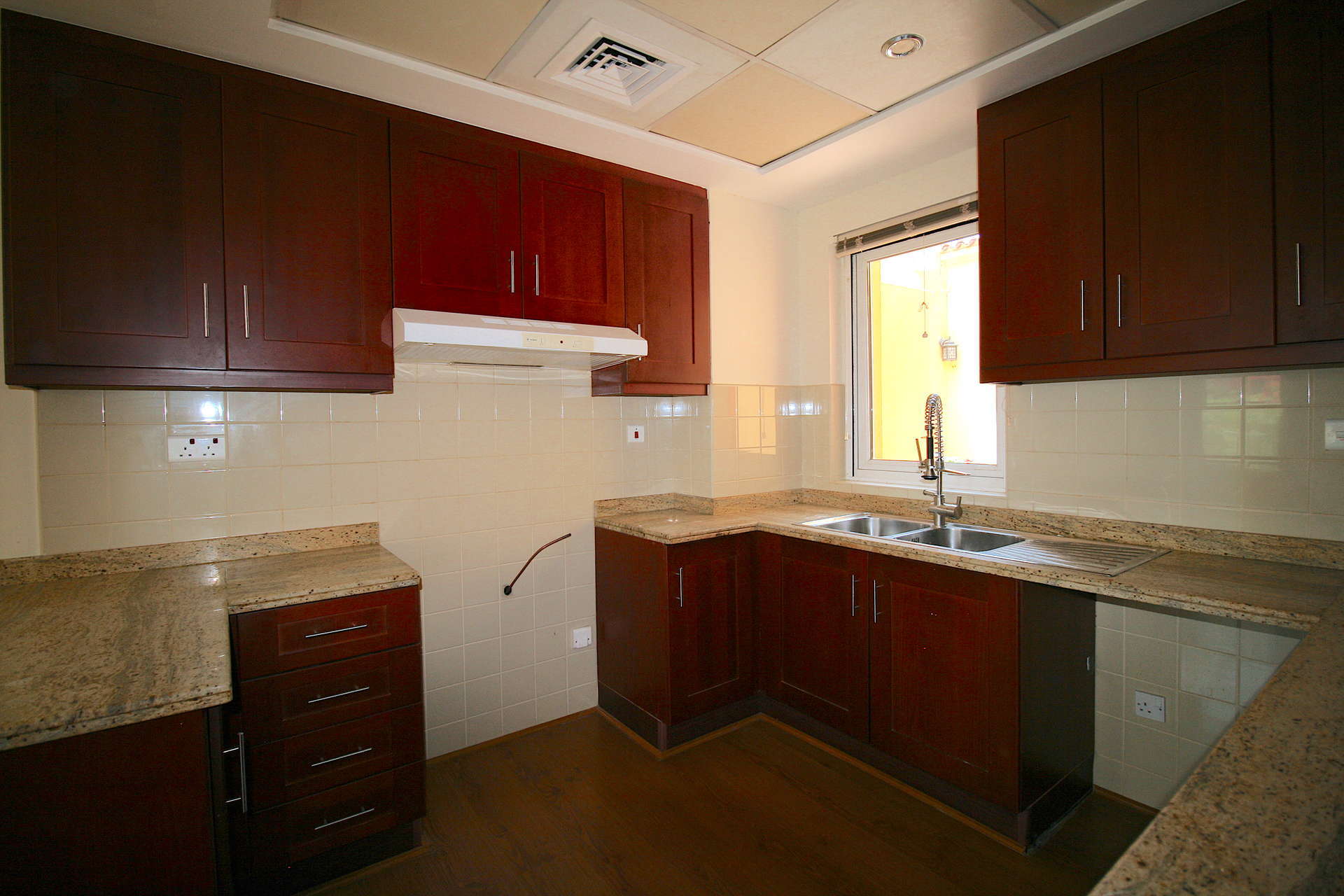 Modern kitchen and living area in 2-bedroom villa, Palmera 3, Arabian Ranches