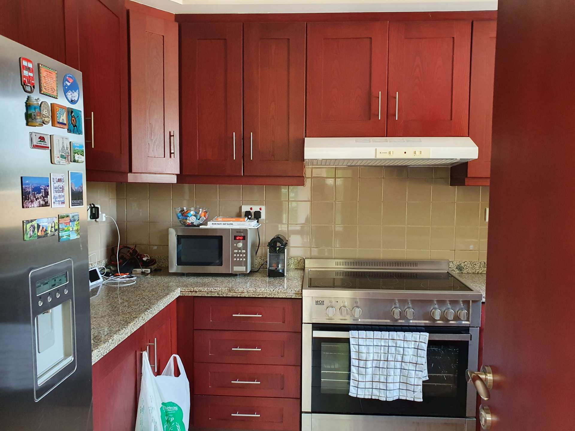 Living room in 2-bedroom villa, Palmera 2, Arabian Ranches with staircase and cozy seating