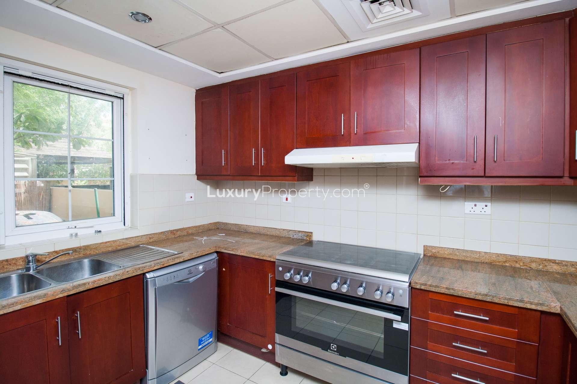 Charming villa living room with patio view, Palmera 1, Arabian Ranches rental