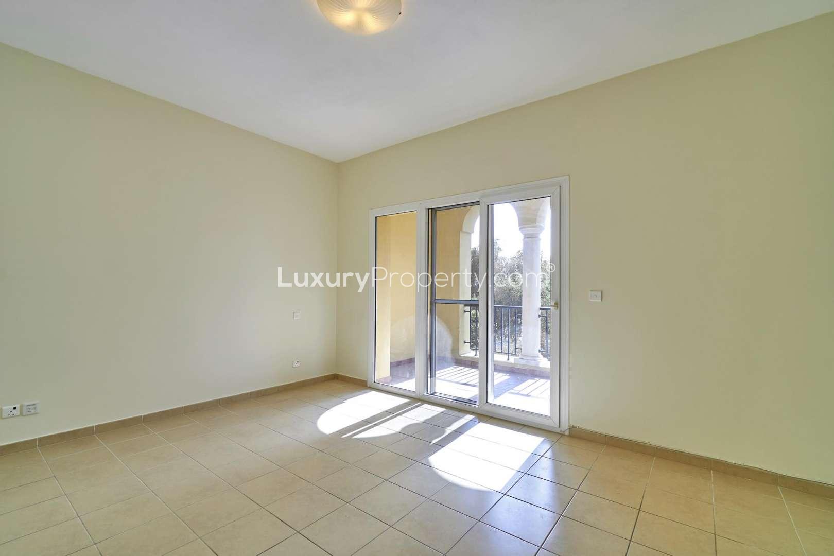 Empty room with tiled floor and window in Palmera, Arabian Ranches villa for rent
