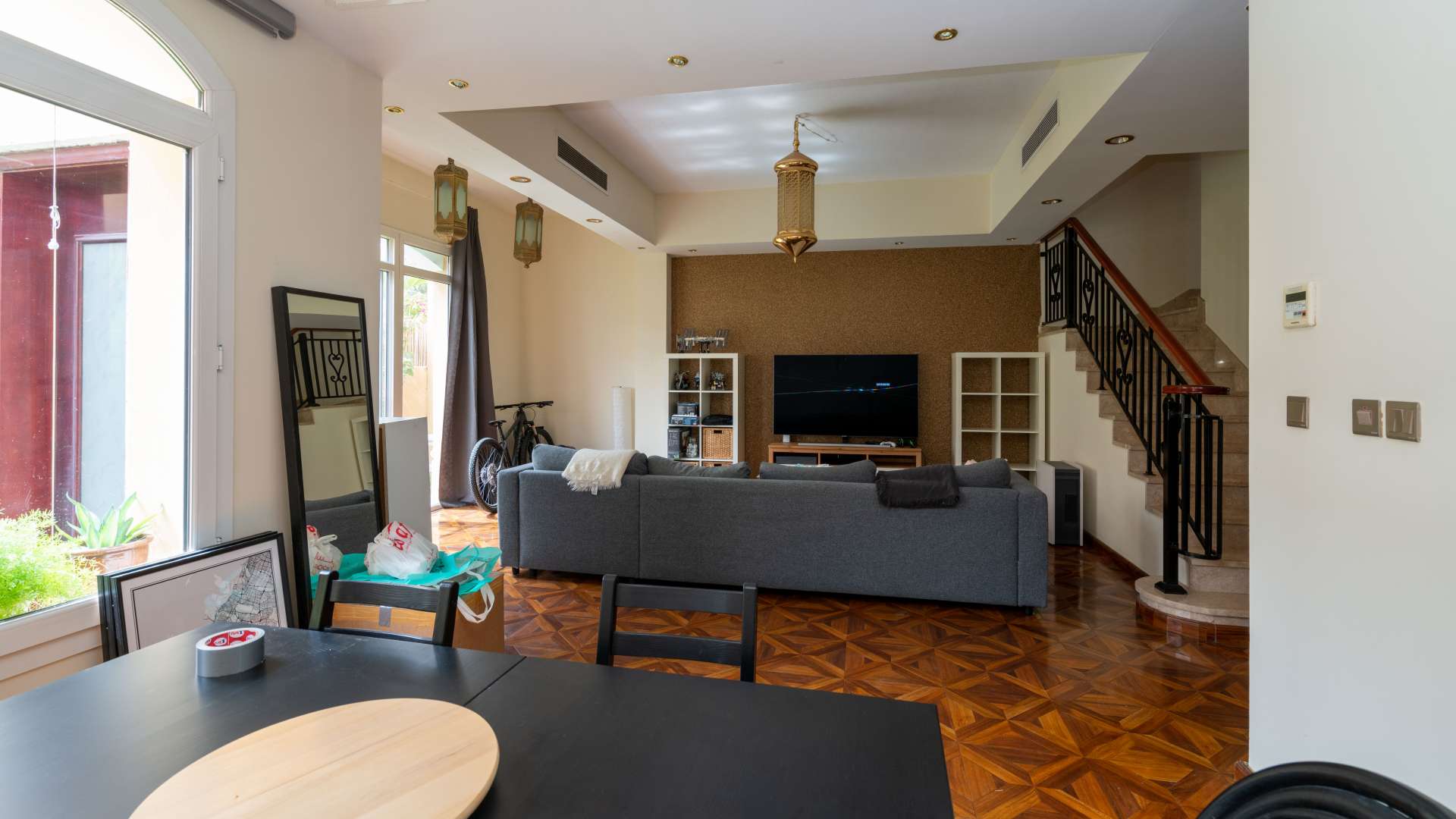 Living room in 2-bedroom townhouse, Palmera 4, Arabian Ranches, with modern decor and staircase
