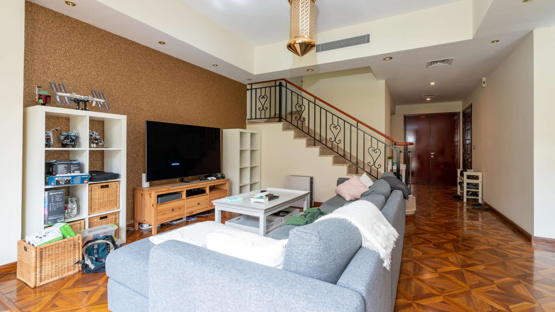 Living room in 2-bedroom townhouse, Palmera 4, Arabian Ranches, with modern decor and garden view