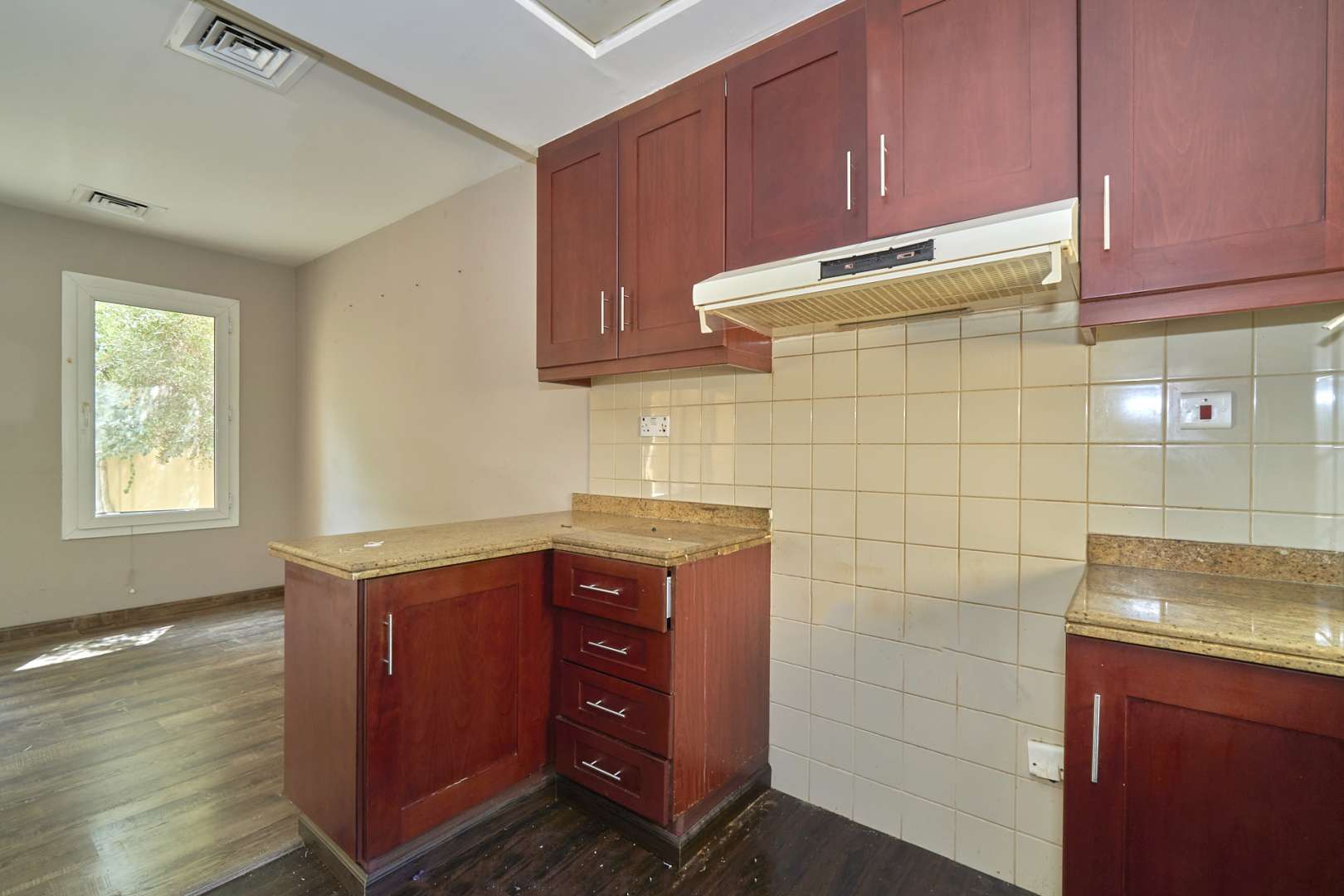 Kitchen with wooden cabinets in 2-bedroom villa, Arabian Ranches, Palmera community