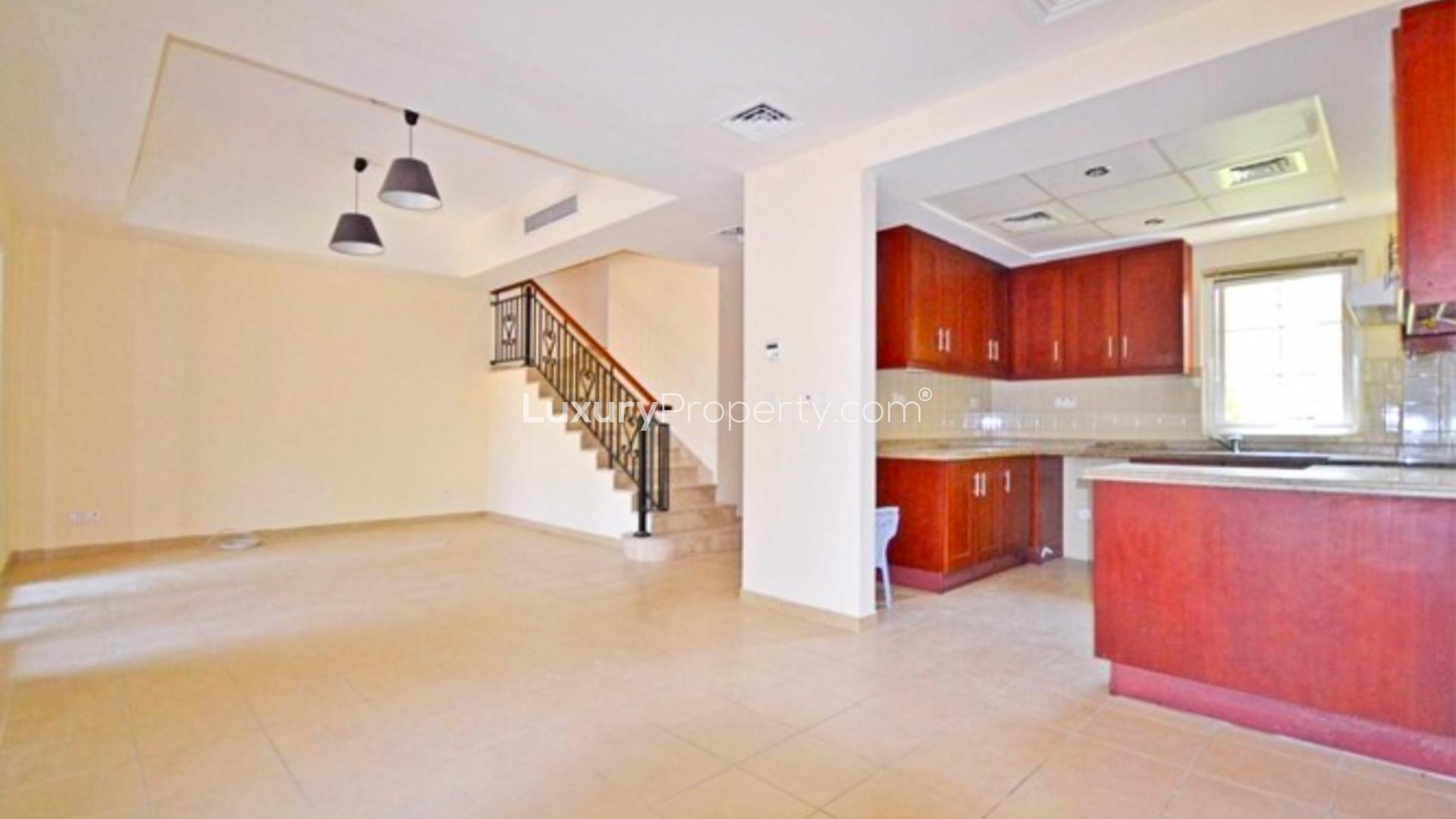 N/A,Interior of vacant 2-bedroom townhouse in Palmera, Arabian Ranches with open-plan kitchen and staircase