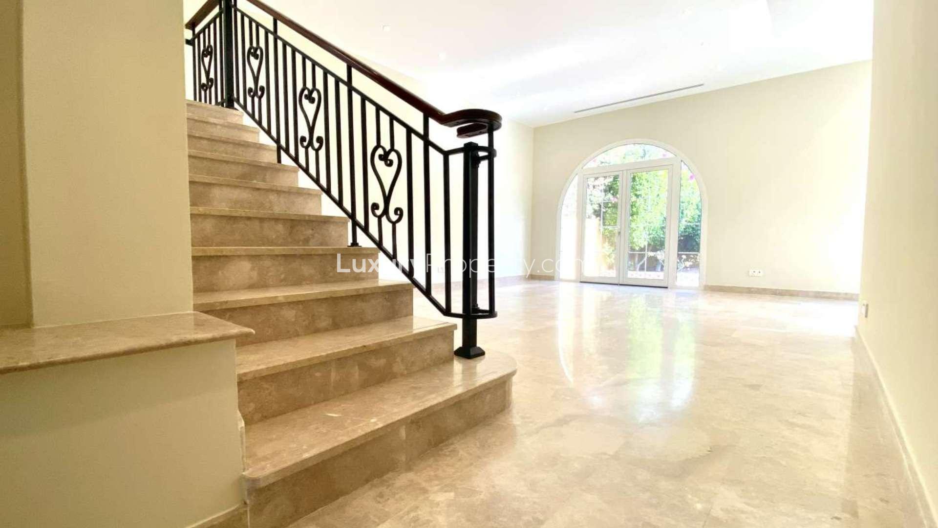 Two-bedroom villa exterior with garden in Palmera, Arabian Ranches, available for rent