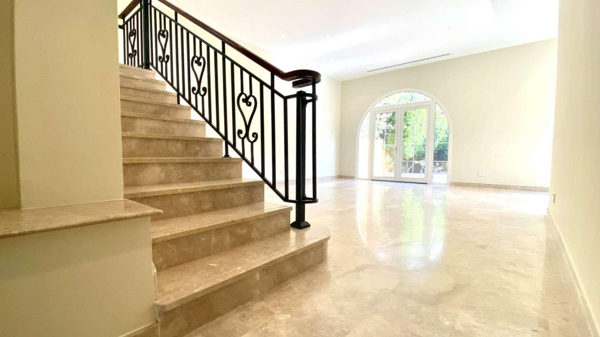 Two-bedroom villa exterior with garden in Palmera, Arabian Ranches, available for rent