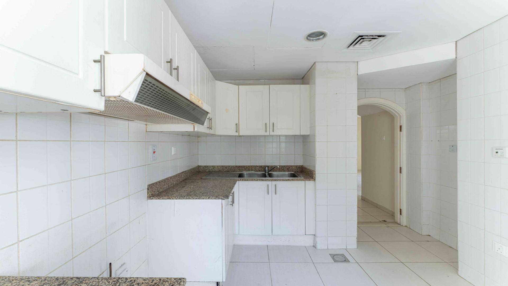 Living room view of 2-bedroom villa in Springs 9, featuring tiled floors and natural light