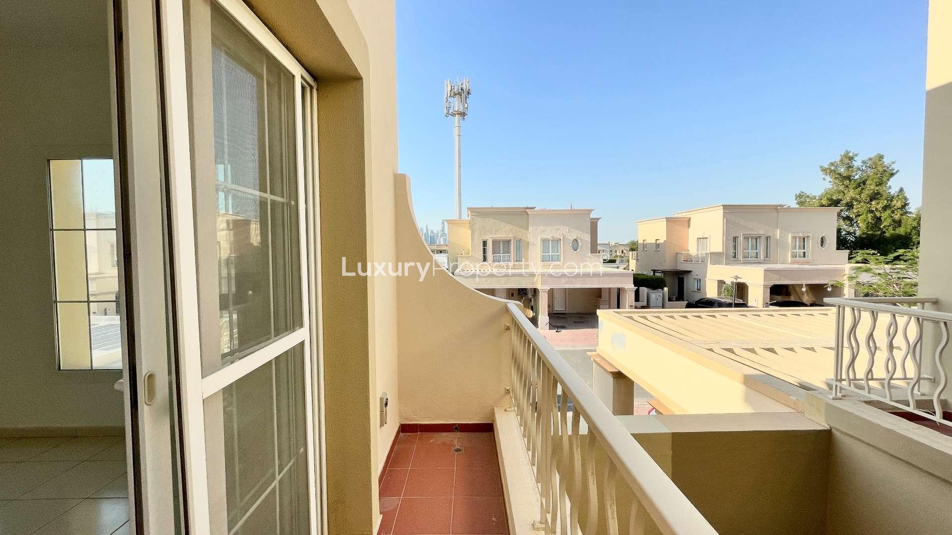 "Covered patio area of vacant villa in Springs 11, available for rent.",Balcony view from vacant villa in Springs 11, two-bedroom rental in The Springs