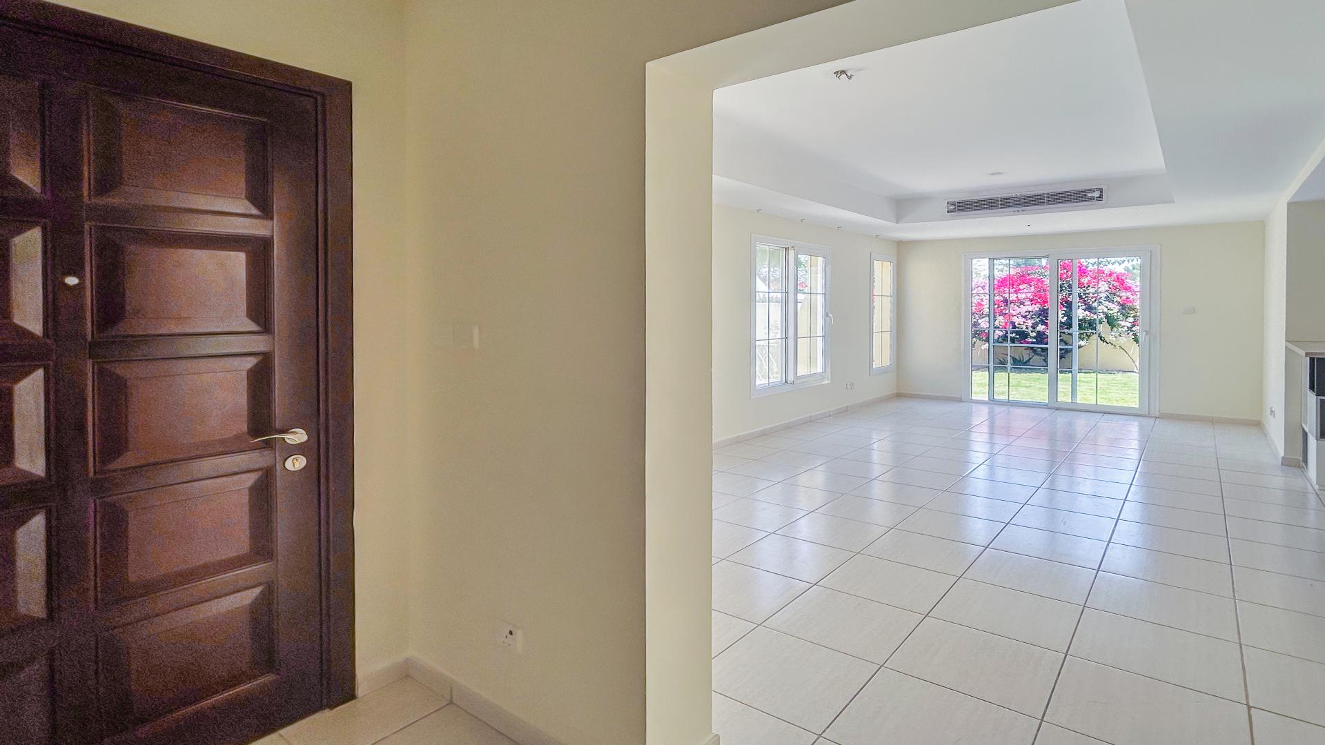 Backyard view of 2-bed villa in Springs 2, Emirates Living, with garden and patio