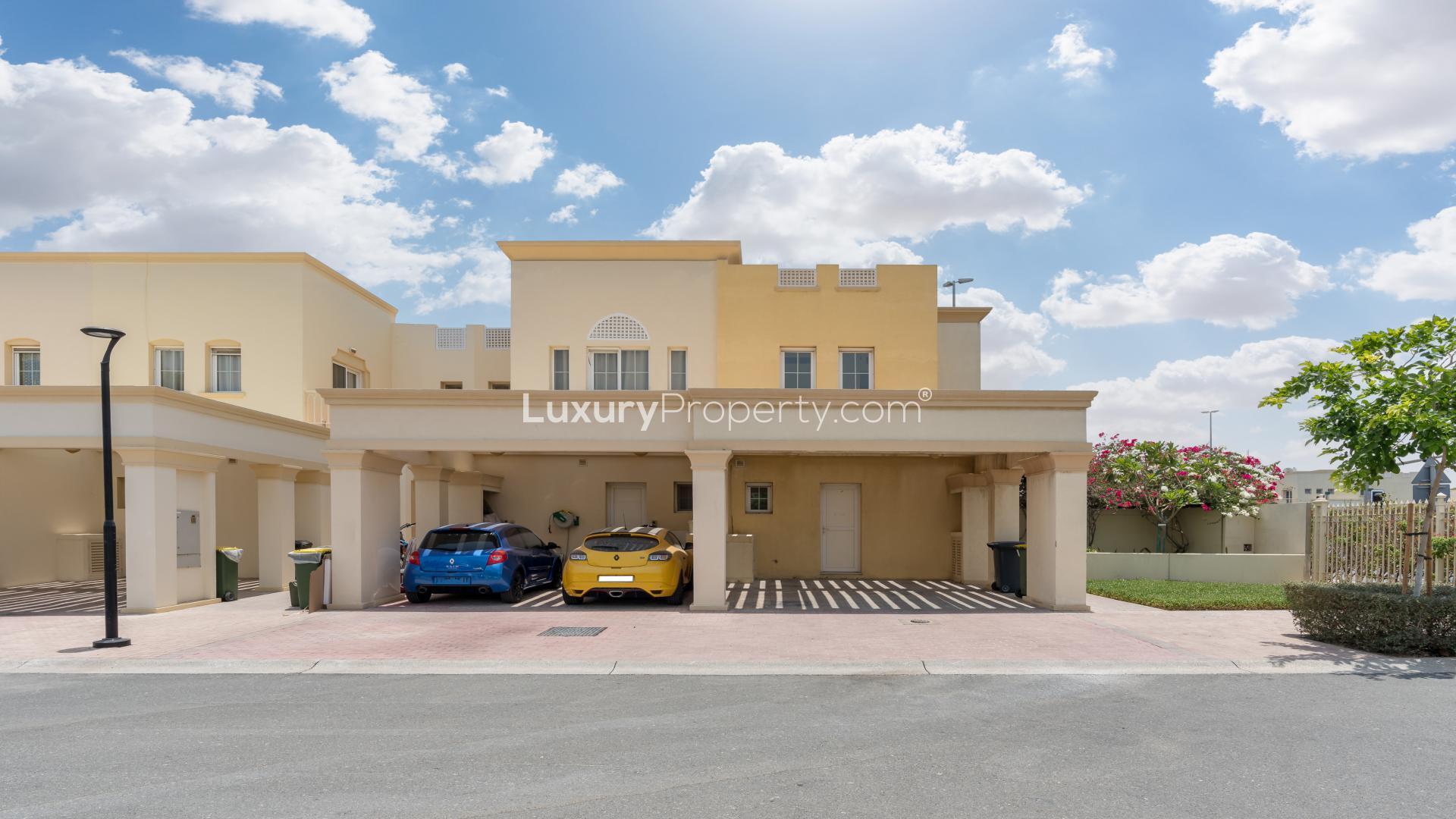 Bright living room with garden view in 2-bedroom villa, The Springs, Emirates Living