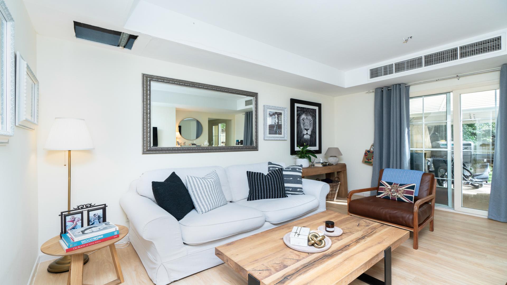 Modern kitchen in 2-bedroom villa, Springs 14, Emirates Living, with marble countertops and appliances