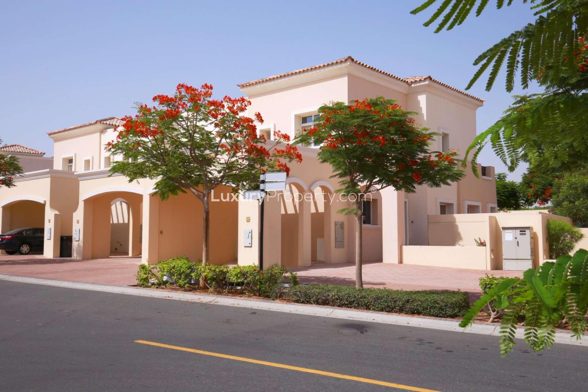 Cosy 3-bedroom villa exterior in Alma, Arabian Ranches for sale, featuring spacious driveway