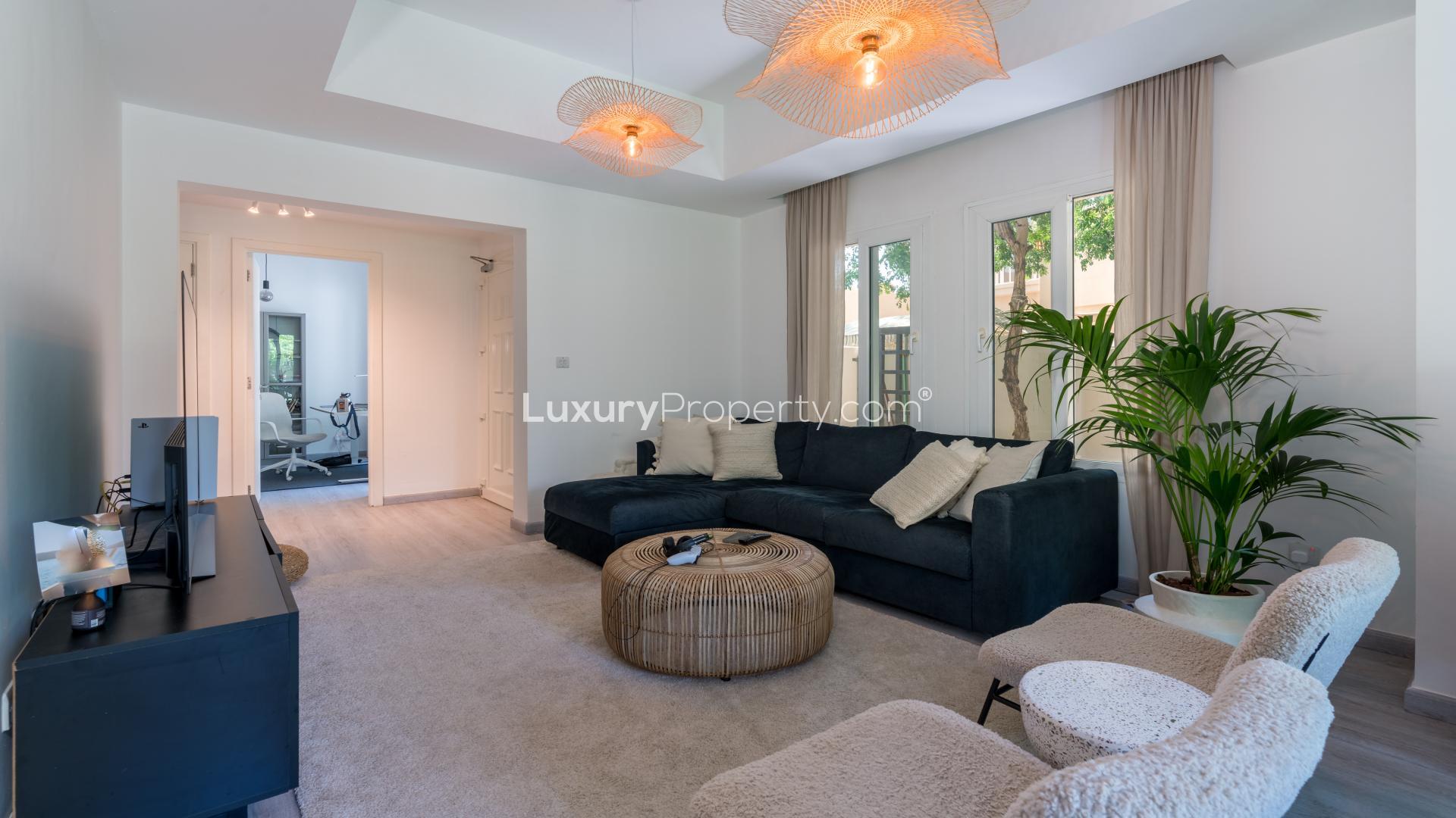 Lush green garden of single-row villa in Maeen, The Lakes community for sale