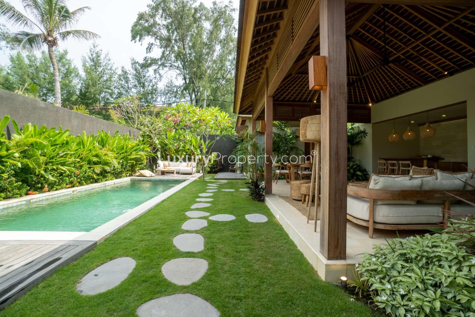 Stylish two-bedroom villa with private pool at Cocana Resort, Lombok, lush garden view
