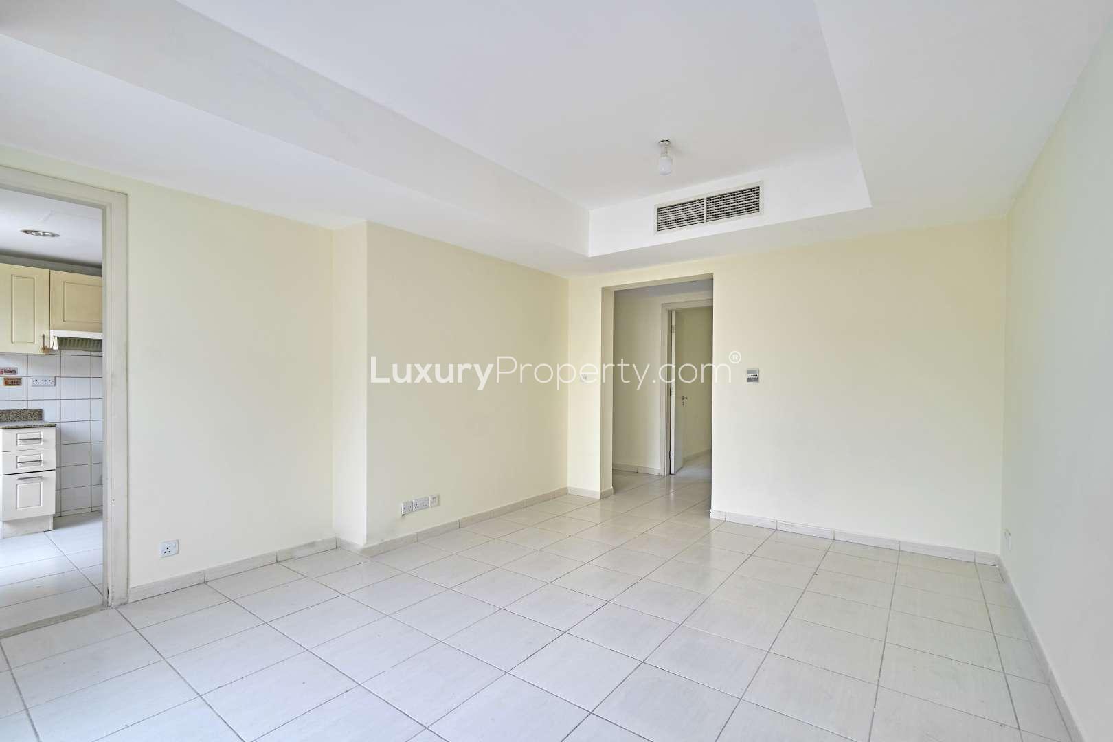 Vacant living room in 2-bedroom villa, Springs 14, Emirates Living, for sale