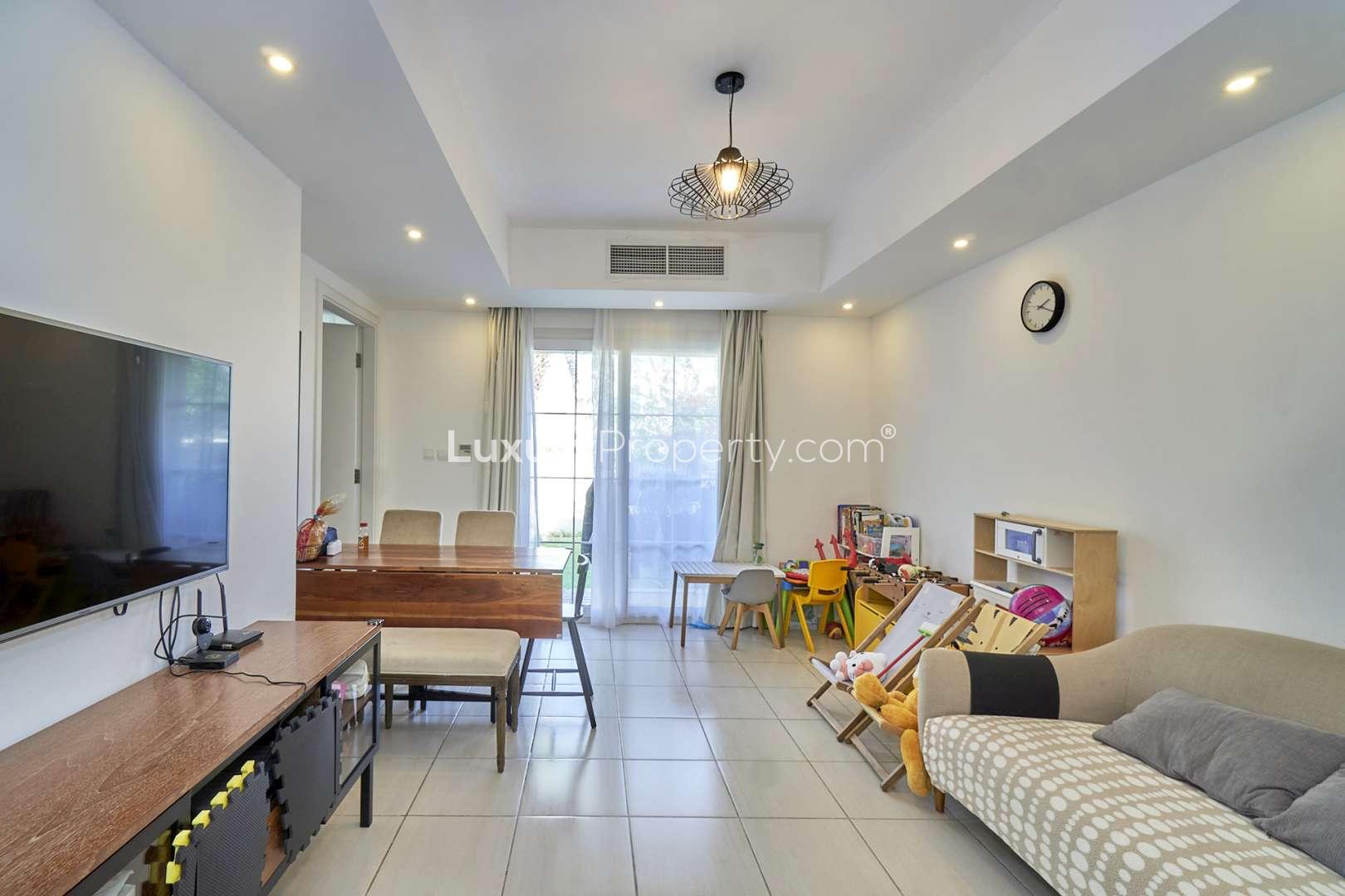 Neat single row villa exterior in Springs 3, Dubai, with driveway and garage