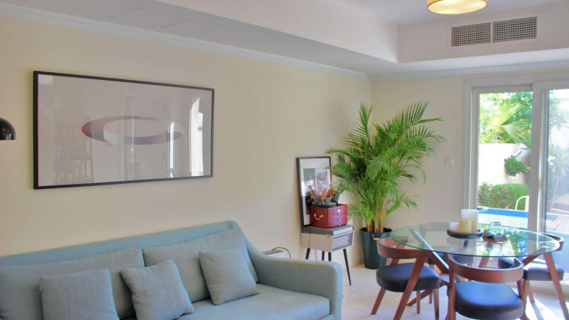 Lush garden view of 2-bedroom villa in Springs 4, Dubai for sale