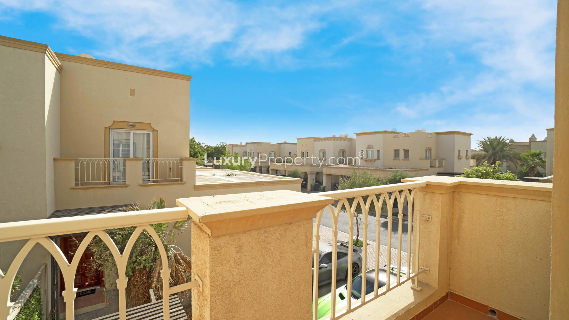 "Private pool and garden of 2-bedroom villa in Springs 8, for sale residential property.","View from balcony of 2-bedroom villa in Springs 8, showcasing community and architecture.",Luxurious living room in 2-bedroom villa, Springs 8, featuring elegant decor and natural light