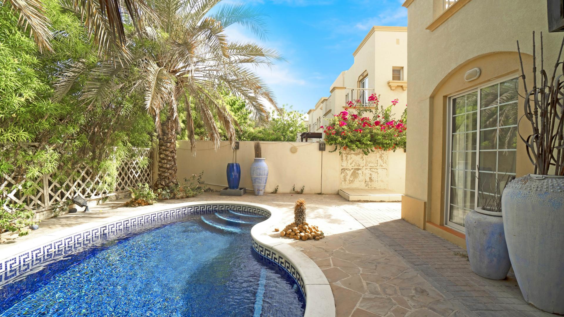 Elegant living room in 2-bedroom villa, Springs 8, with modern decor and natural light
