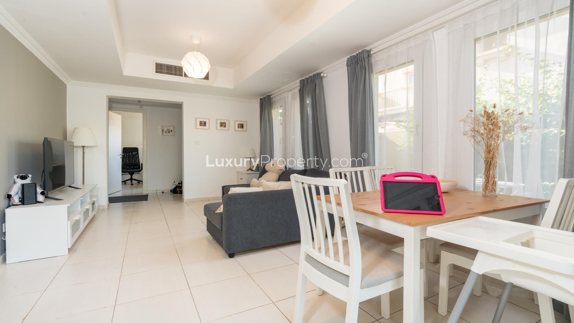 Living room in Springs 4 villa with modern decor, cozy sofa, and natural light