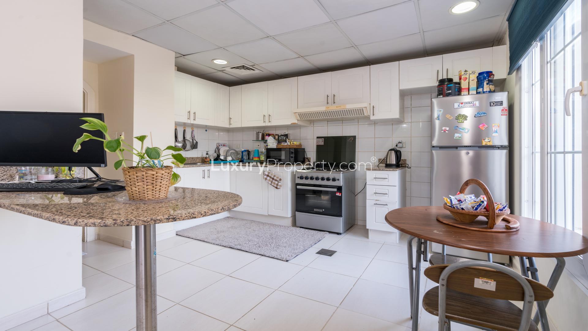 Living room with modern furniture in 2-bedroom villa, The Springs, for sale