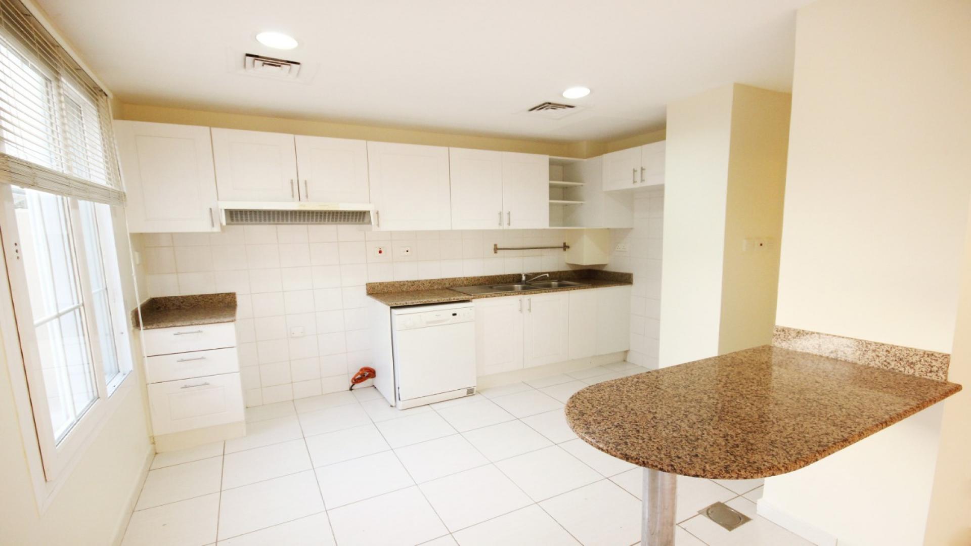 Bright living area with garden view in villa for sale, The Springs