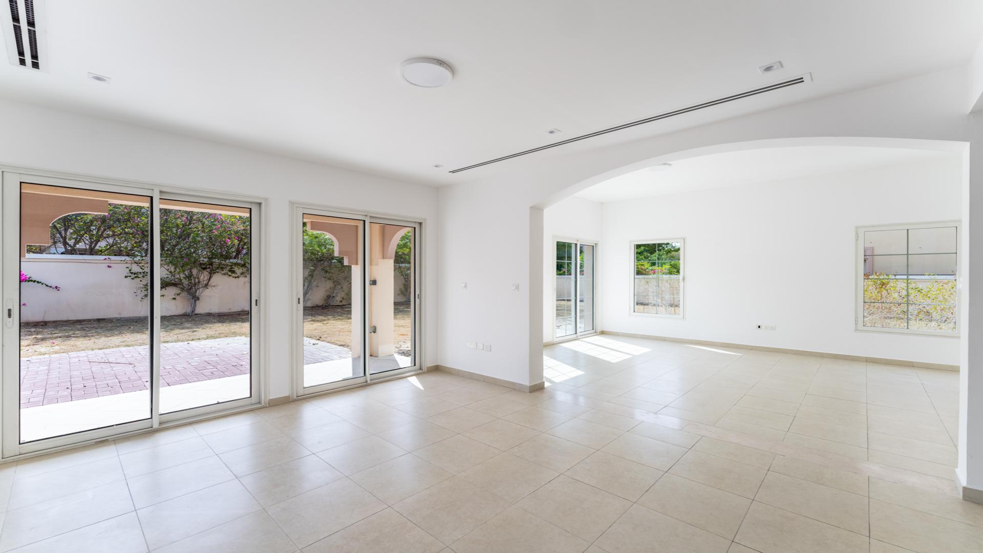 Spacious open-plan kitchen and living area in Jumeirah Village Triangle villa for sale