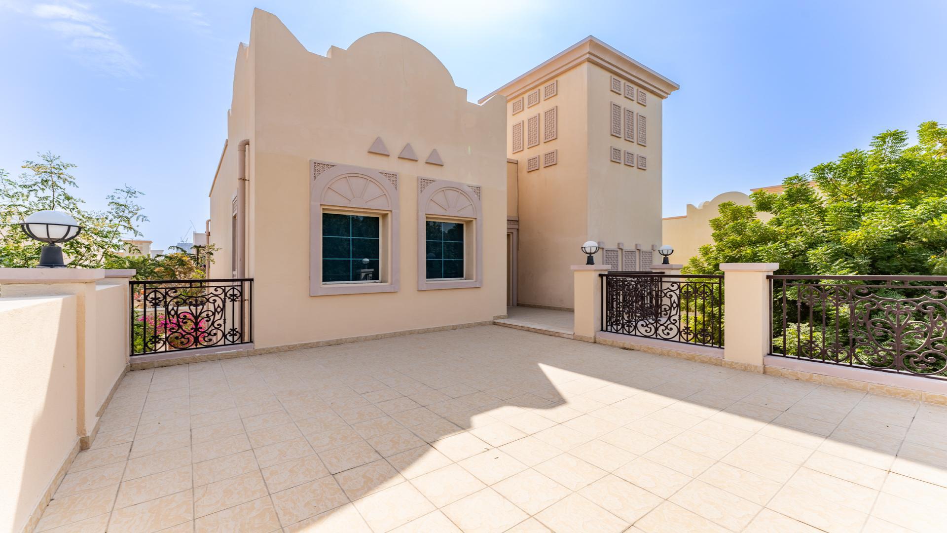 Exterior view of JVT District 3C villa with spacious terrace and decorative railings