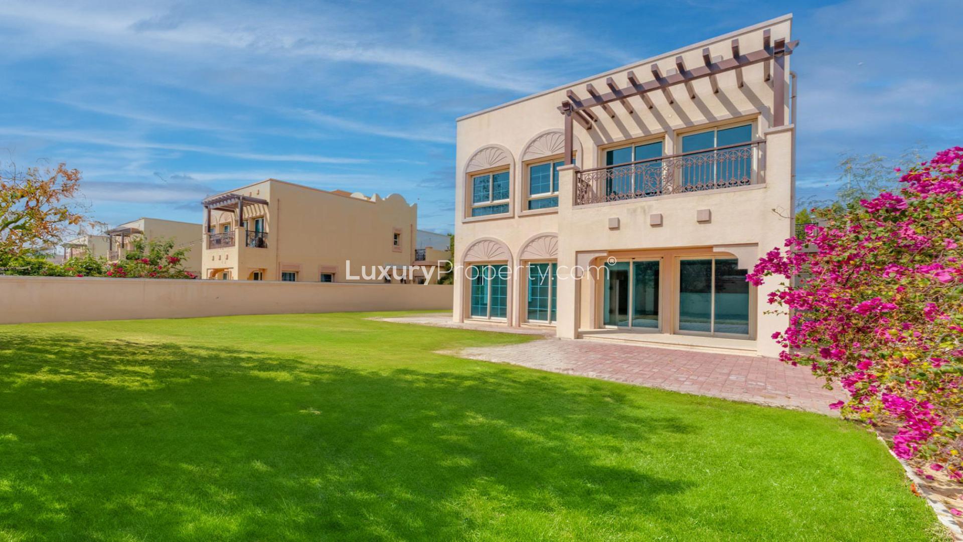 "Spacious JVT villa with lush garden for sale in District 3C, 2-bedroom, 3-bathroom.","Bright interior of JVT villa for sale, featuring modern design and spacious layout.",Bright open-plan kitchen and living area in JVT villa, District 3C, for sale