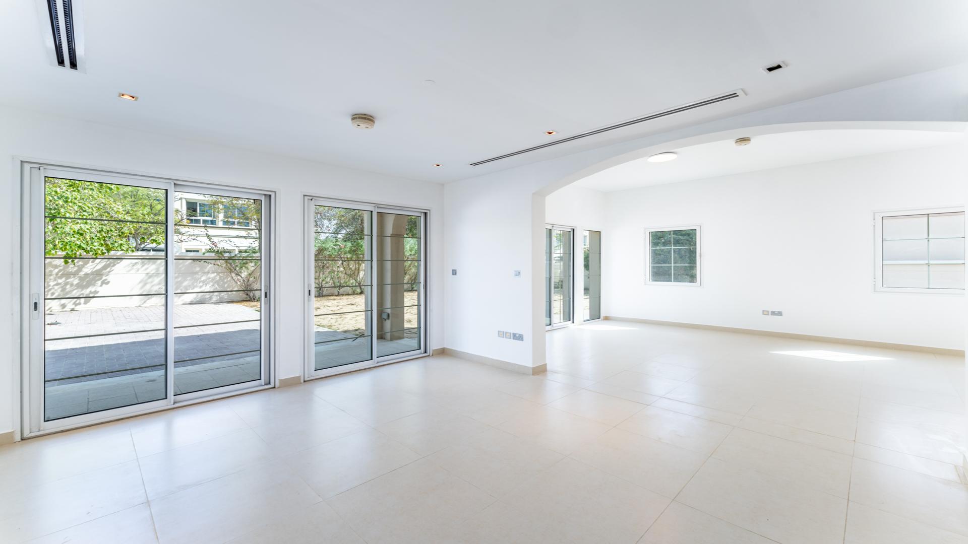 Spacious open-plan living area in contemporary two-bed villa, Jumeirah Village Triangle