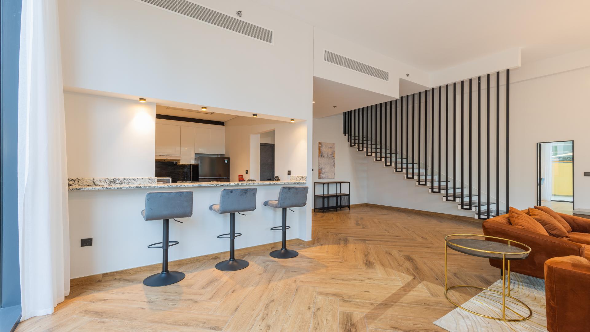 Modern living room in Dubai Marina villa with stylish decor and natural light