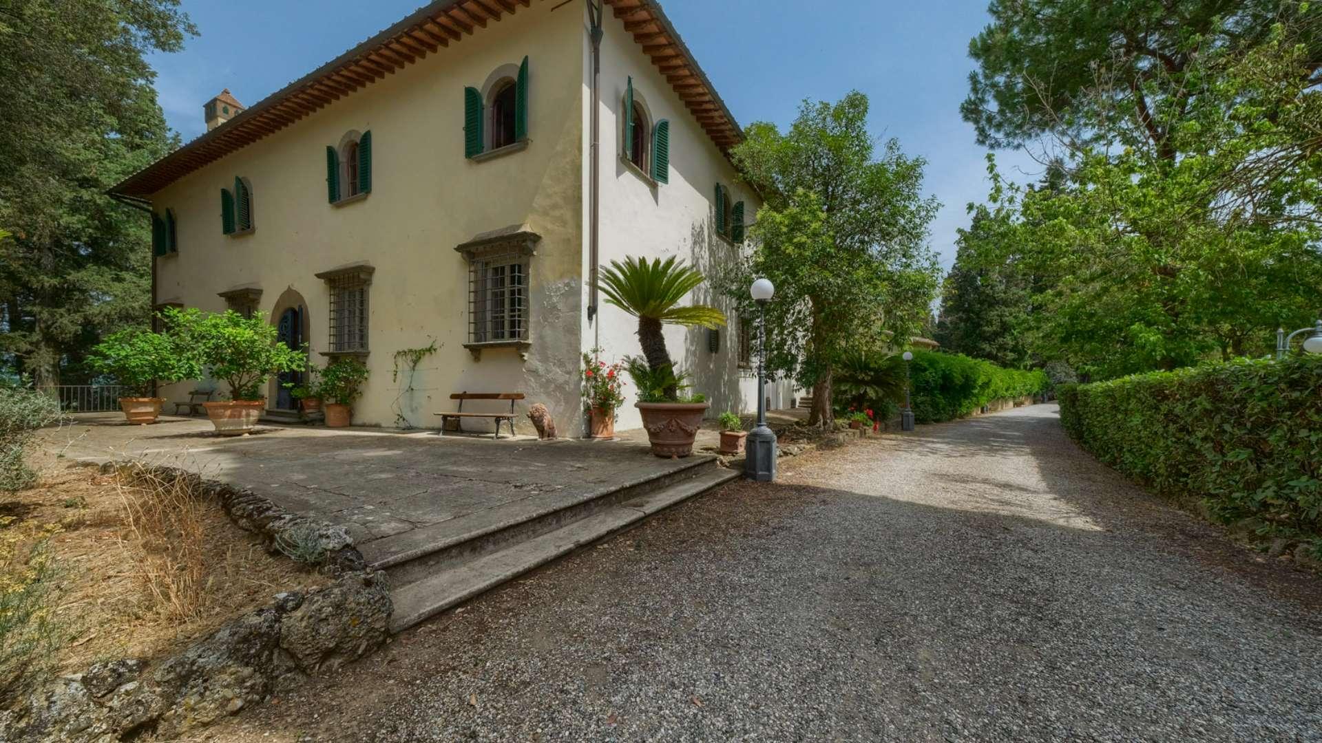 Tuscan villa exterior with lush garden, part of historic estate in Florence for sale