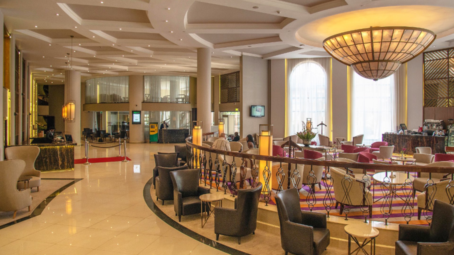 Luxury hotel bar and lounge with elegant spiral staircase in Nairobi's Upper Hill