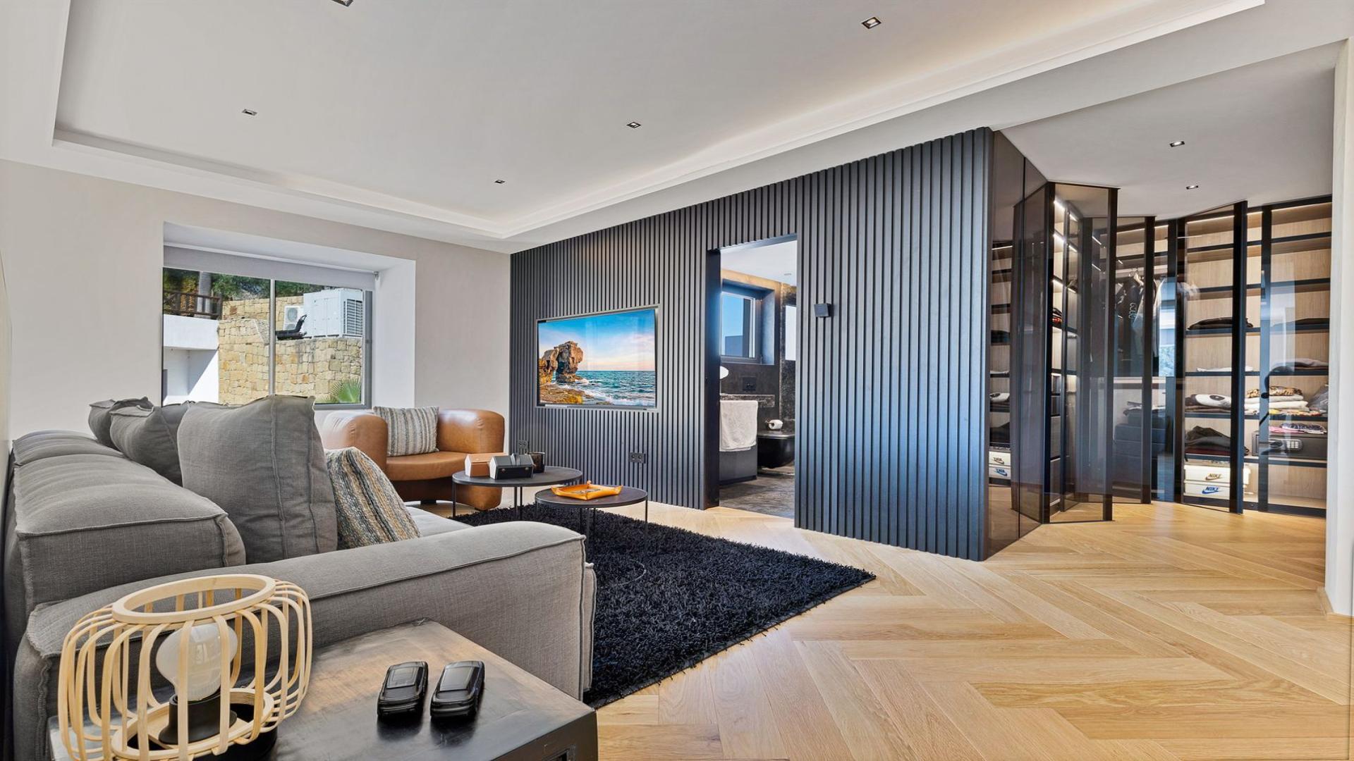 Modern home office in luxury Benahavís villa, featuring sleek decor and large window view