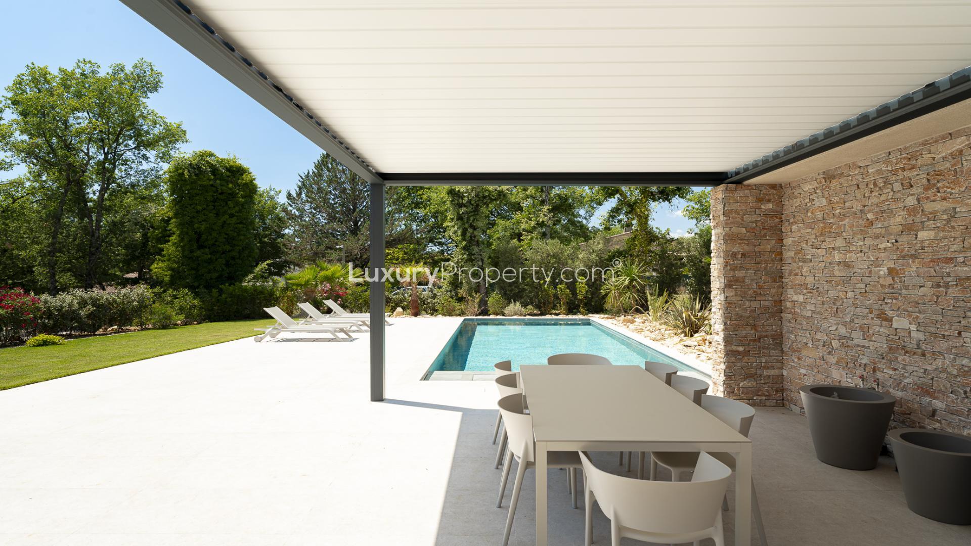 Modern outdoor patio with seating and pool, Domaine de Terre Blanche villa for sale