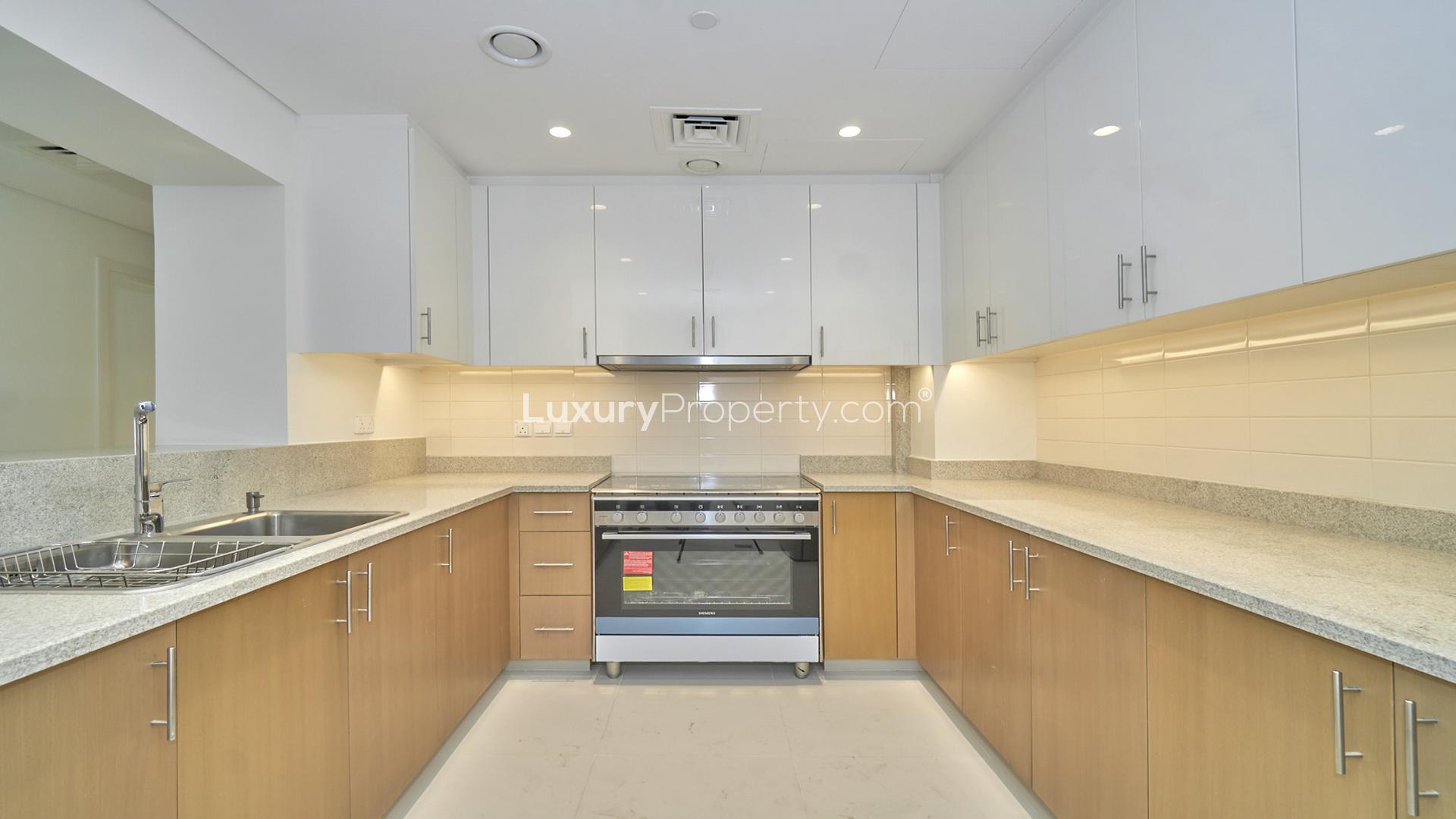 Skyline view of Downtown Dubai from BLVD Crescent apartment, featuring modern high-rise buildings